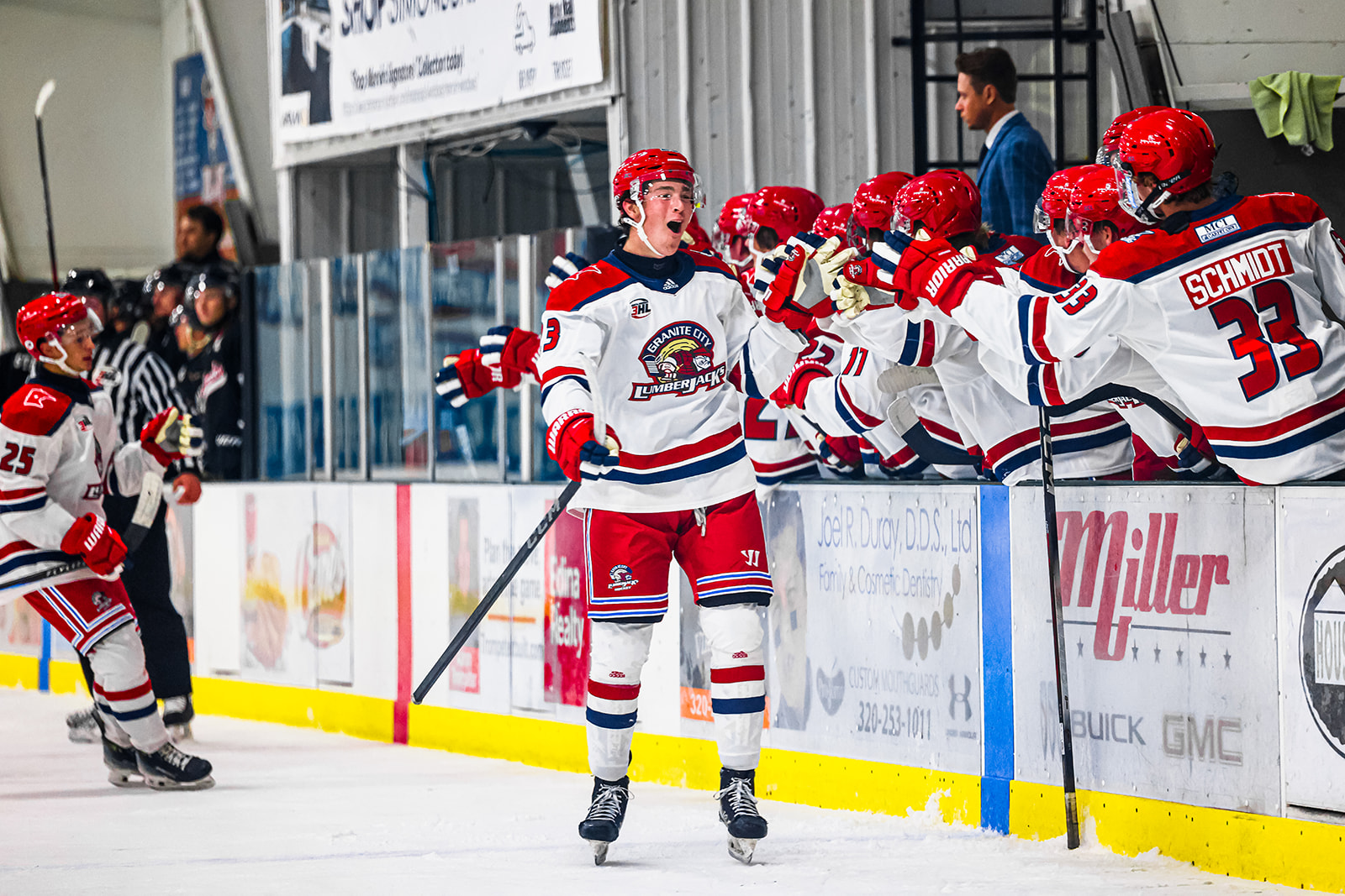 Granite City Lumberjacks players exchanging high fives